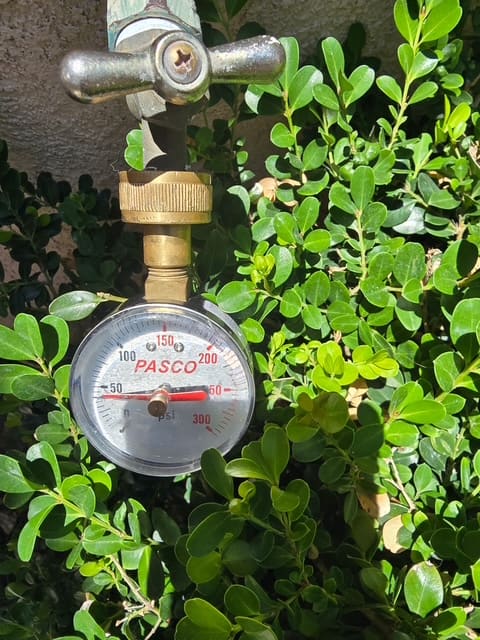 Static pressure test gauge on an outdoor connection during Aliso Viejo leak detection