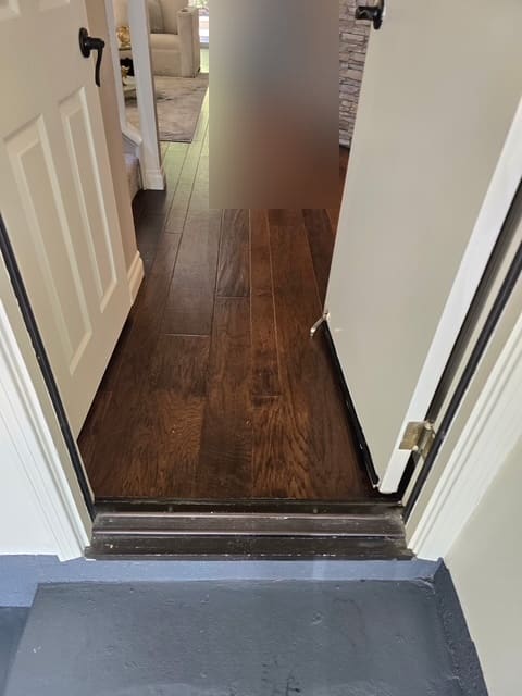 Wood flooring along the path moisture traveled through the Aliso Viejo home