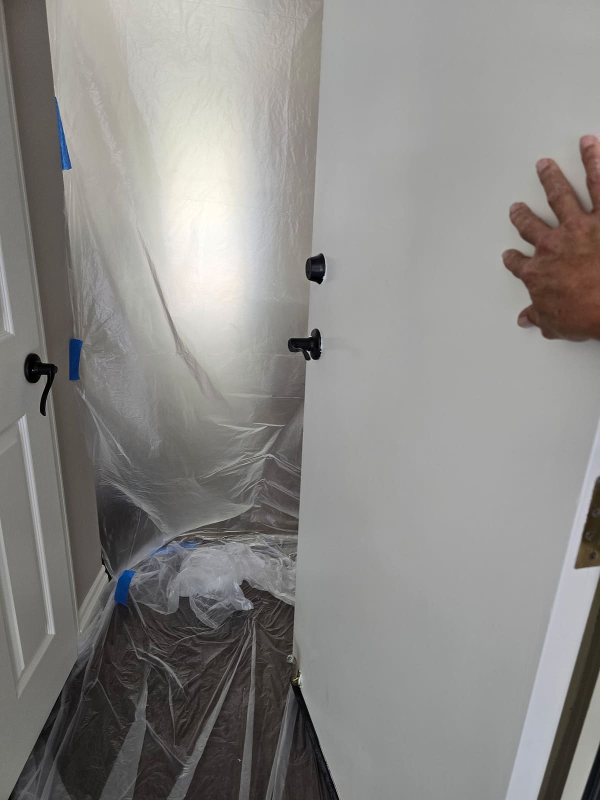 Plastic doorway containment sealing a hallway before a pipe reroute in Aliso Viejo