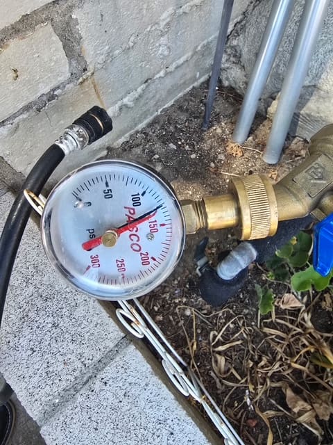Documenting the static pressure gauge reading during a timed hold