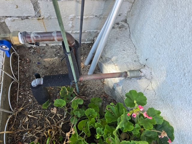 Copper supply piping at the exterior wall of a San Bernardino home during leak testing